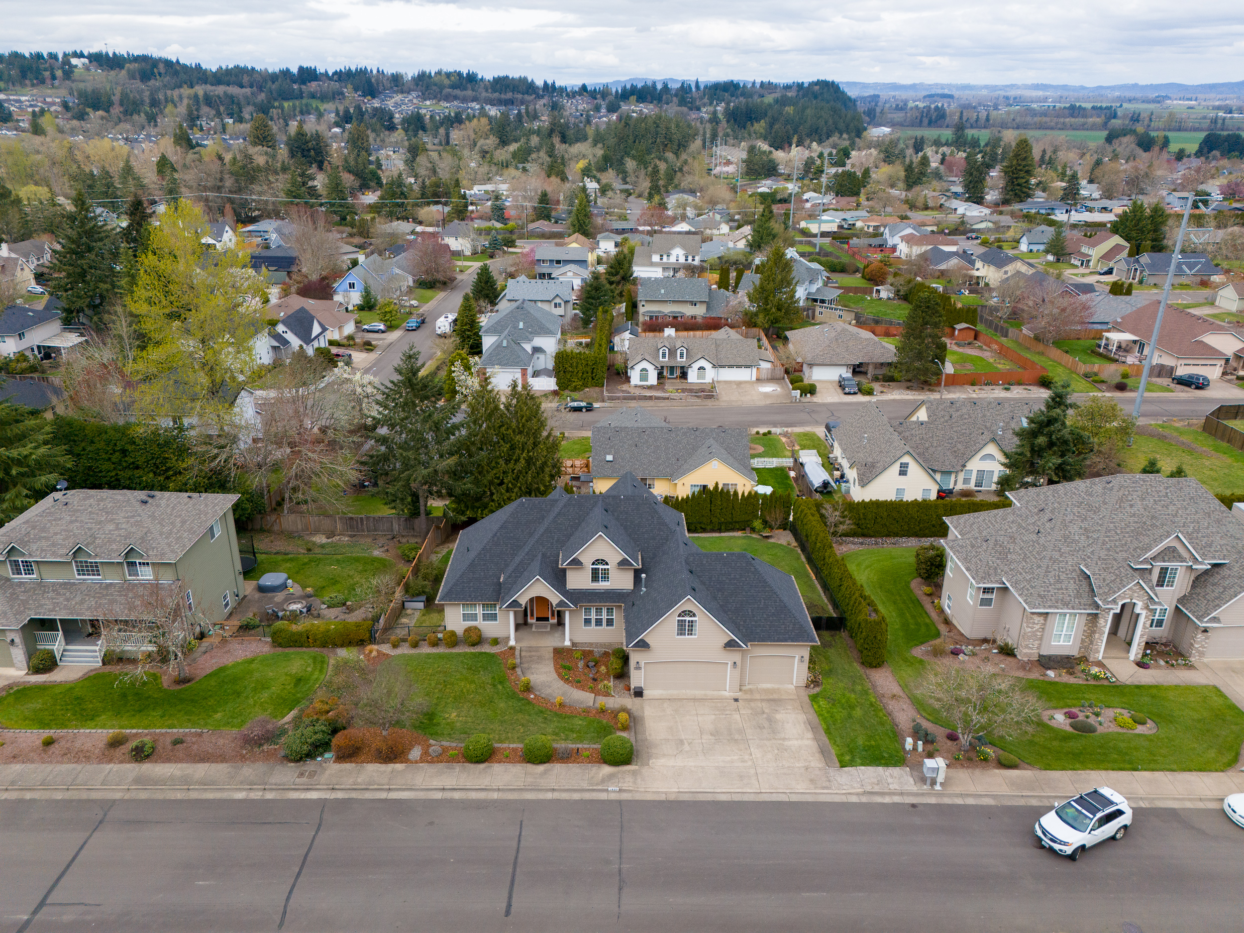 A drone photo that shows a real estate house listing's neighborhood.